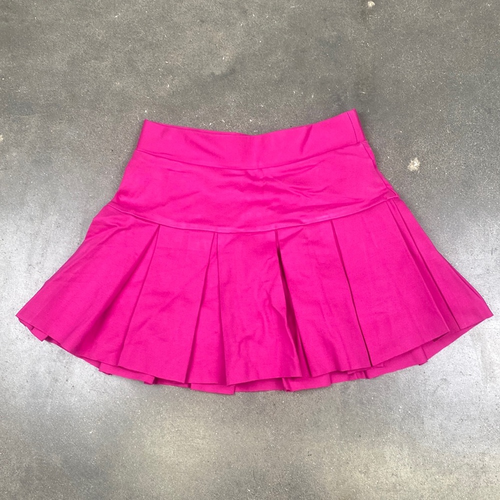 Hot pink mini tennis skirt with under shorts.